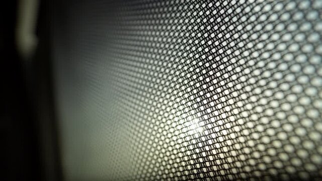 Sunlight Through Mesh In Car Screen Close Up, Delicate Grid Pattern Creating Soft Bokeh And Abstract Geometry, Warm
