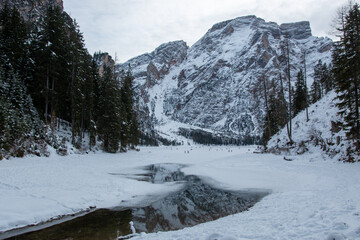 Lake Braies is an alpine lake located in Val di Braies, a side valley of Val Pusteria in winter.