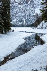 Lake Braies is an alpine lake located in Val di Braies, a side valley of Val Pusteria in winter.