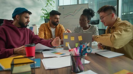 Diverse creative informal office business team collaborating in workspace African woman discussing online data with Asian Indian colleagues men four agents analyzing charts planning innovative startup - Powered by Adobe