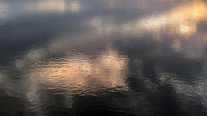 Fototapete Reflection colorful sky at the sunset over the Danube river in Novi Sad reflected on the water surface  © Jana