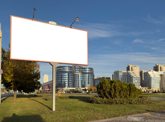 Obraz premium Blank outdoor billboard mock up standing in an urban area with modern residential and office