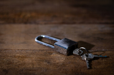 House keys left on an empty table symbolizing abandonment, separation, loneliness, and emotional loss.