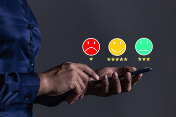 Customer Review, Young Man hand holding Smart Phone with five star to review and give 5 stars with very good results in service, Good review 5 star rating choice feedback