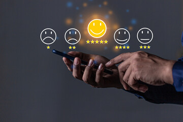 Customer Review, Young Man hand holding Smart Phone with five star to review and give 5 stars with very good results in service, Good review 5 star rating choice feedback