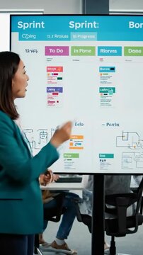 Team members collaborate in an office setting to discuss project details and plans during a work session in the afternoon