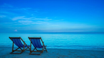 Fototapeta premium Tranquil Beach Getaway: Two Chairs Embrace the Blue Horizon's Serenity