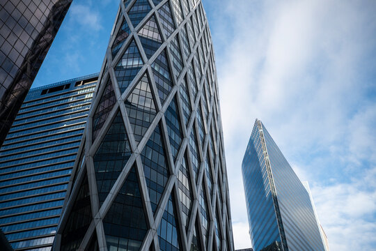 La Defense Paris France financial district skyscraper lattice facade steel highrise sky dramatic low angle wide abstract clean blue tone