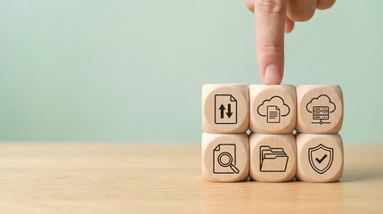 hand clicking on wooden blocks with icons