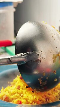 Chef Serving Fresh Poha Into Plate With Ladle
Close up of traditional Indian poha being served into a blue plate using a metal ladle. Ideal for Indian breakfast recipes culinary documentaries 