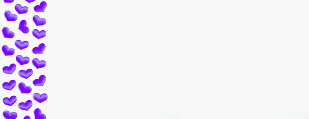 St Valentines day background with purple silk hearts on the white wooden background, free space for text, romantic backdrop