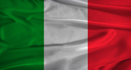 Flag of Italy with fabric textured background. Close up of National flag of Italy with realistic texture