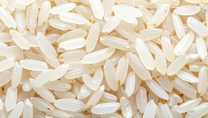 A dense close-up of uncooked white rice grains fills the frame—evoking texture, uniformity, and quiet abundance in a minimalist study of staple simplicity.