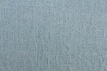 abstract background of old light blue fabric close up
