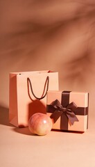 Warm monochromatic e-commerce composition featuring a peach shopping bag, gift box with brown ribbon, and fresh peach fruit on a soft orange background with aesthetic shadows