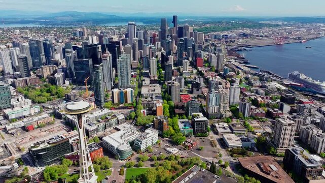 Aerial view over Seattle, Washington, USA, capturing the downtown skyline, urban landscape, and surrounding city environment from above. Ideal for travel and cityscape footage