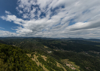Mountain and forest with dramatic cloudy sky