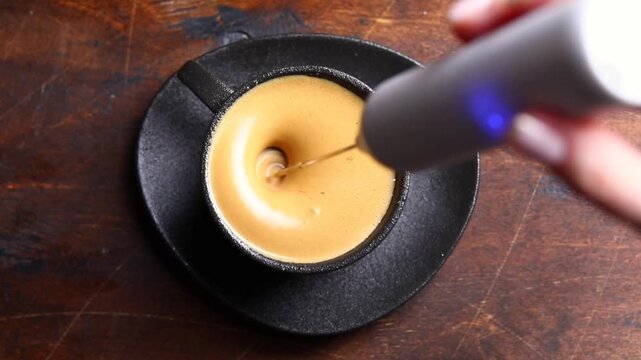 whipping coffee with an electric whisk, whipped coffee