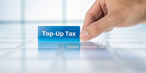 Hand button tax finance business global minimum payment technology concept closeup translucent blue modern digital press finger touch economic corporate government regulation policy accounting