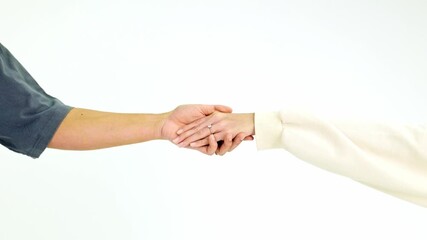 Two people gently hold hands wearing engagement rings against a plain white background. This minimalist scene symbolizes love, trust, and commitment—ideal for evergreen romance or Valentine’s themes.