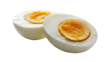 Boiled eggs halves with runny yolks on black background