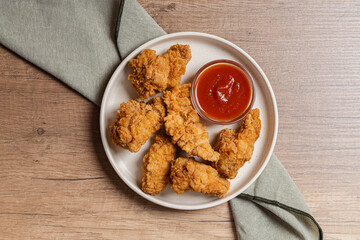 Crispy Chicken Strips and Sauce on Wood