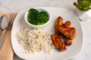 chicken wings with  broccoli and rice