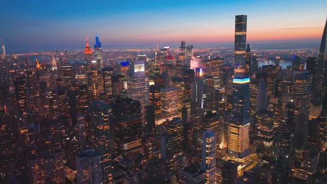 New York City, USA, 10 October 2025,
A high-energy, vibrant aerial shot of Midtown Manhattan's skyline at night, showcasing the incredible density and verticality of New York City.