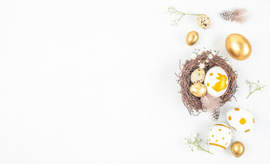 Elegant Easter flat lay with golden and painted eggs in nest, spring decor and large copy space on white background