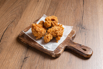 Fried Chicken Wings On Wooden Background