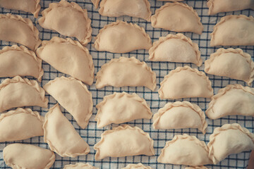 Obraz premium Homemade Ukrainian Vareniki with Potato and Cabbage, Traditional Dumplings Cooked by Grandmother