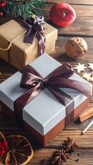 Christmas gifts, tied with ribbons, placed on a rustic wooden table alongside various festive decorations