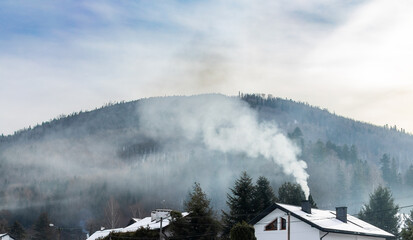 Chimney smoke during a frosty winter, the problem of smog and polluted air PM2.5 PM10