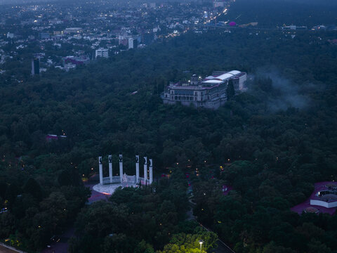 Aerial view of the Chapultepec Castle nestled in the dense, dark green foliage of Chapultepec Park, Mexico City, Mexico.