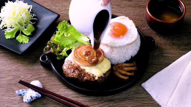 Loco Moco, a traditional Hawaiian dish of teriyaki flavored ground beef patty and a fried egg on a bed of rice, smothered in gravy
