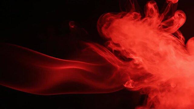 Abstract red smoke cloud on black background artistic vaporous form