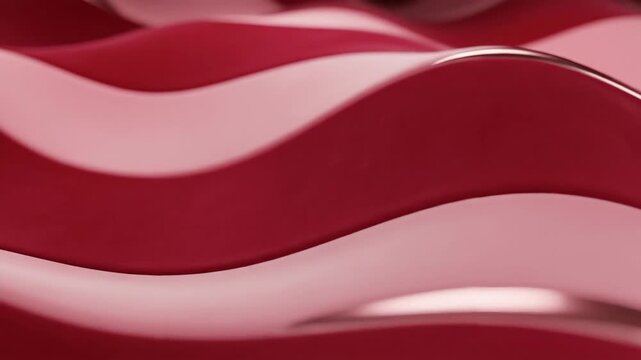 Abstract red wave pattern with smooth curves and reflective surface