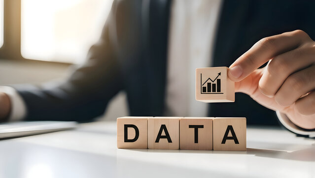 Hand places wooden block with graph symbol on data blocks chart analytics - Powered by Adobe