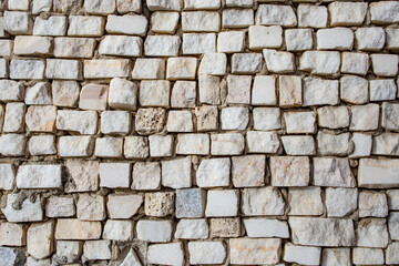 Obraz premium Square shaped granite stone cubes arranged randomly as a wall decoration, abstract patterned close up texture