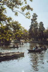 People on pedal boats at Parc de la Ciutadella, Barcelona, Spain