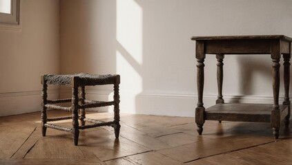 Rustic wooden stool and side table stand on parquet flooring