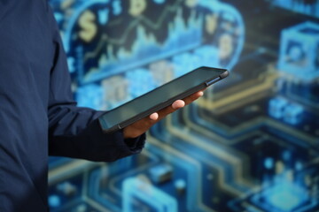 A professional technician utilizes a digital tablet and stylus to manage complex data systems, blending modern touch-screen technology with advanced industrial computing for efficient workflow