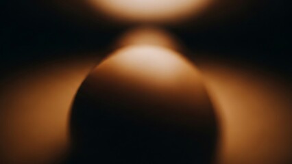 Warm and cozy abstract background with glowing orbs of light in dark space with soft focus effect