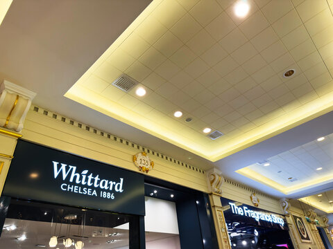 Whittard Chelsea 1886 and The Fragrance Shop storefronts in Manchester UK mall interior