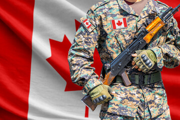 Fototapeta premium Canada flag with soldier in military uniform holding assault rifle in front of it