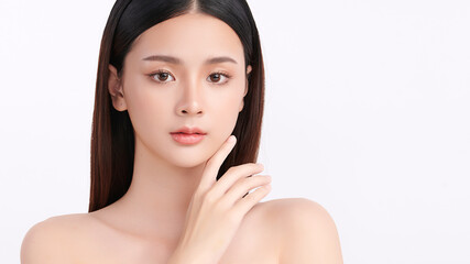 A beautiful young Asian woman with clean, fresh skin against a white background. Skincare, facial treatment, cosmetology, beauty, and spa. An elegant portrait of an Asian woman.