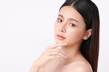 A beautiful young Asian woman with clean, fresh skin against a white background. Skincare, facial treatment, cosmetology, beauty, and spa. An elegant portrait of an Asian woman.