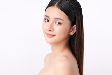 A beautiful young Asian woman with clean, fresh skin against a white background. Skincare, facial treatment, cosmetology, beauty, and spa. An elegant portrait of an Asian woman.