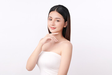 A beautiful young Asian woman with clean, fresh skin against a white background. Skincare, facial treatment, cosmetology, beauty, and spa. An elegant portrait of an Asian woman.