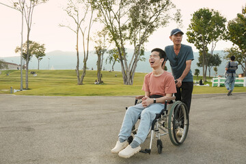 A joyful outdoor lifestyle moment of a smiling wheelchair user enjoying time in a park with family support. Natural light scene expressing happiness, confidence, emotional connection, and inclusive ev